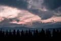 Mountains, sunset and silhouettes of trees