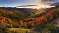 Mountains at sunset in Slovakia. Landscape with mountain hills orange trees and grass in fall, colorful sky with golden sunbeams. Royalty Free Stock Photo