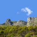 Mountains, sunshine and blue sky with nature, clouds and stone with landscape and environment. Empty, rock and grass Royalty Free Stock Photo