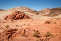 Mountains surrounding Fire wave during wonderful sunny day with blue sky, in Valley of Fire State Park, Nevada Royalty Free Stock Photo