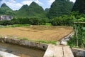 Mountains surrounding a house farm field outside Yangshuo, China