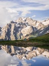 Mountains and tent reflecting in lake Royalty Free Stock Photo