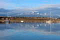 Mountains and town Ushuaia reflecting in water, Patagonia