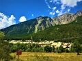 Mountains, trees, clouds and the town