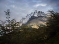 Mountains under dark clouds landscape, shadow play on hill side