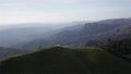 Mountains under mist in the morning at Nern Chang Suek, Thong Pha Phum National Park, Kanchanaburi province, Thailand, panning in