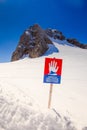 Avalanche danger sign on top of Dachstein Glacier, Mountains in Upper Austria Royalty Free Stock Photo