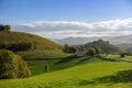 Mountains valley with house and road. Pyrenees autumn landscape. Scenic meadows and agricultural fields in hills valley. Royalty Free Stock Photo