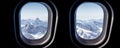 Mountains view through jet plane windows high on the sky. Winter snowy mountains Royalty Free Stock Photo