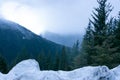 Mountains in the winter hiding in the fog.