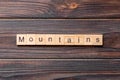 mountains word written on wood block. mountains text on cement table for your desing, concept Royalty Free Stock Photo
