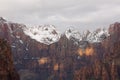 Mountains of Zion National park as seen from the overlook trail in Zion National Park with snow, clouds and a few spots of sun Royalty Free Stock Photo