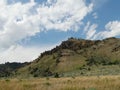 Landscape with beautiful clouds in the skies seen from North Fork Highway in Wyoming Royalty Free Stock Photo