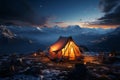Mountainside tent aglow in the tranquil evening or early morning