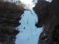 Ice climber climbing frozen water of kangchon waterfall in Chunc