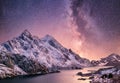 Mountans and reflection on the water surface at the night time. Sea bay and mountains at the night time. Milky way above mountains Royalty Free Stock Photo