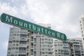 Mountbatten road sign with high rise condominium as background