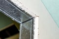 Mounted green plasterboards to an aluminum loft frame, visible black screws. Royalty Free Stock Photo