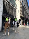 Mounted police officers near London Bridge on duty protecting citizens