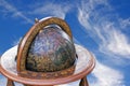 Mounted Retro World Globe Against Blue Cloudy Sky Royalty Free Stock Photo