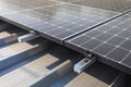 Mounted on the roof of the building solar panels for trapezoidal sheet metal. Royalty Free Stock Photo