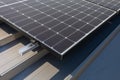 Mounted on the roof of the building solar panels for trapezoidal sheet metal. Royalty Free Stock Photo