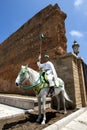 A mounted soldier at the 12th Century walled entrance to Hassan Tower in Rabat, Morocco.