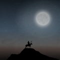 A Mounted Warrior Under The Moonlight Royalty Free Stock Photo