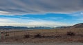 Mountians between blue sky and clouds