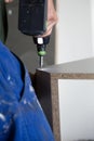 Mounting furniture with screwdriver Royalty Free Stock Photo