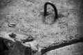 Mounting metal monochrome loop on a concrete slab, soft focus