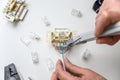 Mounting the RJ45 module, attaching the wire to the computer socket in the room