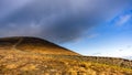 Mourn Wall on the bank of Slieve Donard mountain with blue sky, white clouds and sunlight