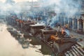 Mournful cremation ceremony at Pashupatinath Temple complex, view from Pandra Shivalaya site