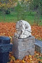 Mournful sculpture on a gravestone. Goritsky Monastery of Dormition in the city of Pereslavl-Zalessky. Russia