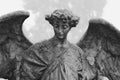 Mourning angel sitting on mausoleum on Cemetery Cimitero Monumentale Milan, Italy Royalty Free Stock Photo