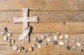 Mourning background - cross, stones and feather for an obituary notice Royalty Free Stock Photo