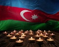 Mourning candles burning on Azerbaijan national flag of background. Memorial weekend, patriot veterans day, National Day of