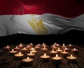 Mourning candles burning on Egypt national flag of background. Memorial weekend, patriot veterans day, National Day of Service