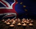 Mourning candles burning on European Union And Union Jack flags background. Memorial weekend, patriot veterans day, Day of Service