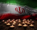 Mourning candles burning on Iran national flag of background. Memorial weekend, patriot veterans day, National Day of Service