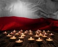 Mourning candles burning on Poland national flag of background. Memorial weekend, patriot veterans day, National Day of Service