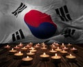 Mourning candles burning on South korea national flag of background. Memorial weekend, patriot veterans day, National Day of