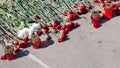 Mourning and flowers on the pavement Royalty Free Stock Photo