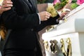 Mourning People at Funeral with coffin Royalty Free Stock Photo