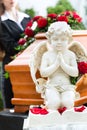 Mourning Woman at Funeral with coffin Royalty Free Stock Photo