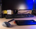 Mouse and graphic tablet on a wooden desk