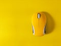 yellow computer mouse on yellow background Royalty Free Stock Photo