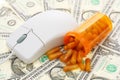 Mouse with a pills and money Royalty Free Stock Photo