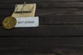 Mouse trap, backside of bitcoin and the word not afraid. Royalty Free Stock Photo